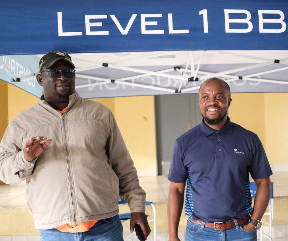 Tri star employees standing at the mandela outreach for BEE
