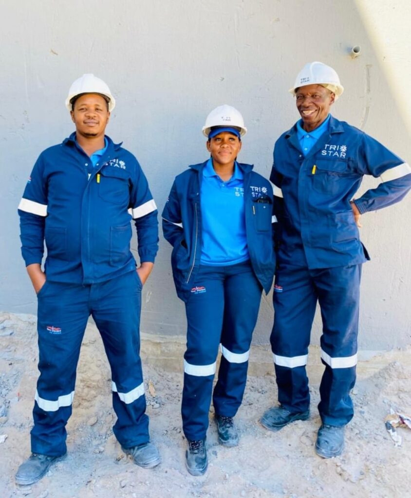 Tri star construction workers posing in safety gear
